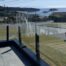 Frameless glass railings for upper deck with Departure Bay in the background. Railings by K&S Railings.